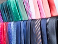 Row of Neckties on hangers in men clothing store Royalty Free Stock Photo