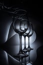 row on elegant wine glasses, dark