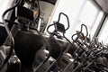 Row of elliptical cross trainer in modern fitnes sport club