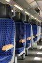 Row of empty blue seats on a train