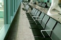 Row of empty chairs in the departure lounge of the airport