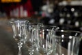 Row of empty clean glasses on counter in bar Royalty Free Stock Photo