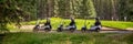 Row of empty electric carts on the side of the golf course, in Banff, Alberta Canada Royalty Free Stock Photo