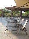 A row of empty lounge chairs Royalty Free Stock Photo