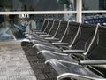 Row of empty seats in airport hall