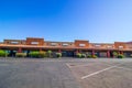 Row Of Empty Store Fronts In Commercial Building