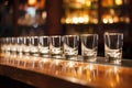 a row of empty water glasses on a bar counter Royalty Free Stock Photo