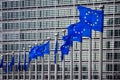 Row of EU Flags in front of the European Union Commission building in Brussels. Belgium - July 30, 2014