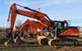 Row of excavators lined up in a construction site Royalty Free Stock Photo