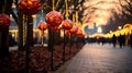 festive red and golden lighted Christmas ornaments lining a path, with people and trees adorned with lights in the