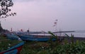 a row of fishing boats on the Teluk Penyu beach