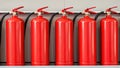 Row of five red fire extinguishers mounted on a wall Royalty Free Stock Photo