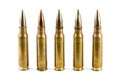 Row of five rifle bullets Royalty Free Stock Photo