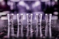A Row of Five Shot Glasses, With Vodka Shots, Render Royalty Free Stock Photo