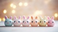 A row of five small ceramic rabbits with different colored eyes, AI