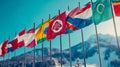 Row of flags from different countries are hanging on poles Royalty Free Stock Photo