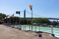 Row of Flags and the Empty Astoria Park Pool during Summer with the Triborough Bridge in the Background in Astoria Queens New York