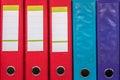 Row of folders for papers and documentation on a shelf in the office Royalty Free Stock Photo