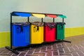 Row of four colored bins for separate garbage Royalty Free Stock Photo