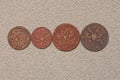 A row of four old red brown copper Russian coins