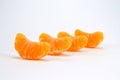 Row of four parts of tangerine Royalty Free Stock Photo