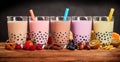 Row of fresh boba bubble tea glasses on wooden background