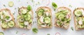 A row of fresh cucumber and radish tartines ready for eating. Royalty Free Stock Photo