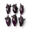 Row of fresh purple eggplants isolated on white background close up