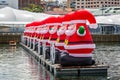 Row of gigantic inflatable santas