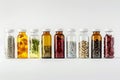 Row of glass bottles filled with various pills for food storage Royalty Free Stock Photo