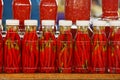 A row of glass jars with canned red pepper on the display shelf Royalty Free Stock Photo