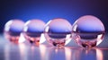 a row of glass spheres in front of a blue background Royalty Free Stock Photo