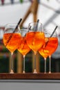 The row of glasses with Aperol Spritz summer cocktail Royalty Free Stock Photo