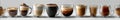 A row of glasses filled with different types of coffee Royalty Free Stock Photo