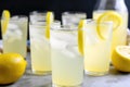 a row of glasses filled with refreshing and tangy lemonade