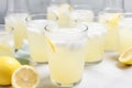 a row of glasses filled with refreshing and tangy lemonade