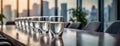 Row of glasses filled with water on a polished conference room table in a modern office setting. Royalty Free Stock Photo