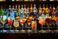 A row of glasses with various drinks on a bar counter Royalty Free Stock Photo