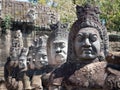 Row of Statues Guarding the Entrance to Angkor Thom in Cambodia