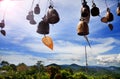 Row of golden bells in buddhist temple. Background of mountains in asia, tailandia