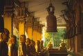 A row of golden buddha statue at Wat Intharam Kanchanaburi, Thai Royalty Free Stock Photo