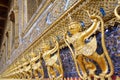 Row of golden Garuda are beautifully decorated on the wall of the Emerald Buddha temple in Wat Phra Kaew at Grand Palace Royalty Free Stock Photo