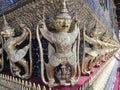 Golden Garuda decorated on the walls of the Emerald Buddha temple in Grand Palace Royalty Free Stock Photo
