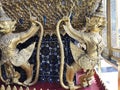 Golden Garuda decorated on the walls of the Emerald Buddha temple in Grand Palace Royalty Free Stock Photo