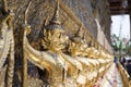 Row of golden Garuda are beautifully decorated on the walls of the Emerald Buddha temple in Grand Palace Royalty Free Stock Photo