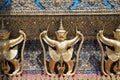 Row of golden Garuda are beautifully decorated on the walls of the Emerald Buddha temple in Grand Palace Royalty Free Stock Photo