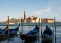 Gondolas against boats and San Giorgio Maggiore island, Venice, Italy Royalty Free Stock Photo