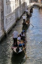 Row of gondolas under the Bridge of Sighs in Venice, Italy