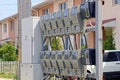 A row of gray electric meters and a metal box for electrical wiring Royalty Free Stock Photo