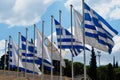 Row of Greek and Olympic Flags Royalty Free Stock Photo
